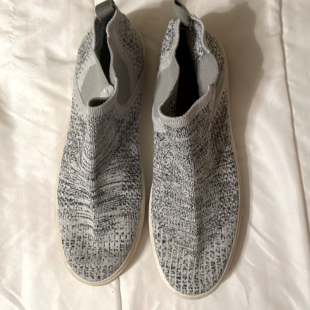 Slip on shoes with black threading.